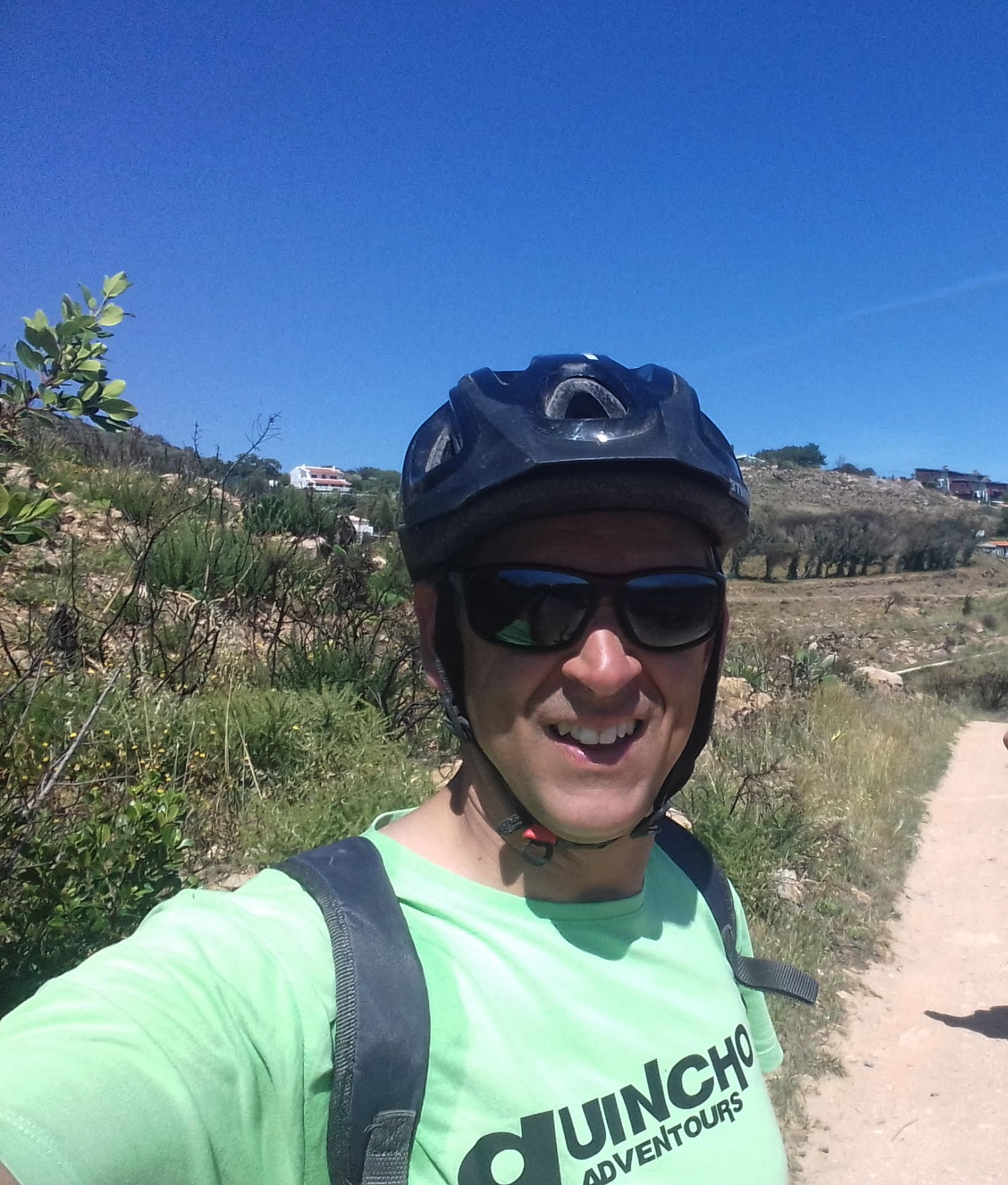 Arlindo — owner and lead guide, on the trail in a Guincho Adventours shirt